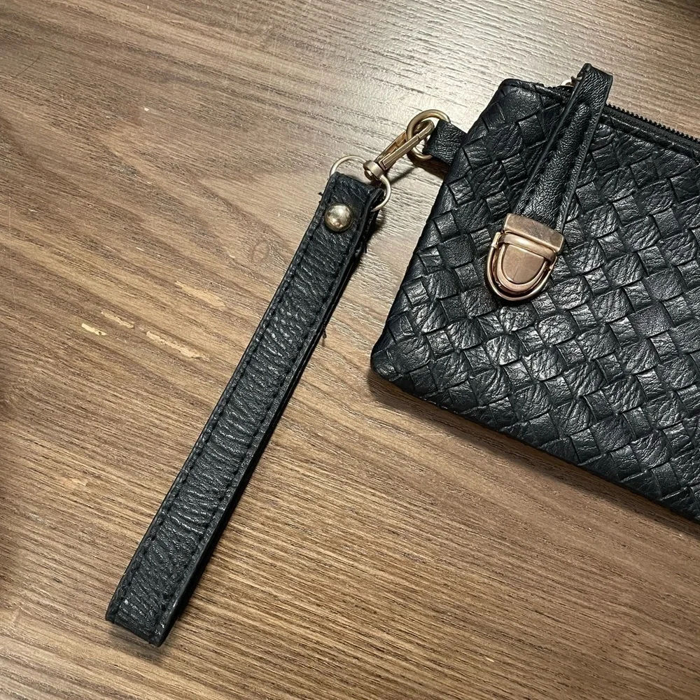 Small Black Pattern Wristlet With Zipper & Metal Clasp Closure.
